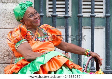 HAVANA, CUBA - JANUARY 8, 2015 : Senior black woman wearing a traditional dress in Old Havana