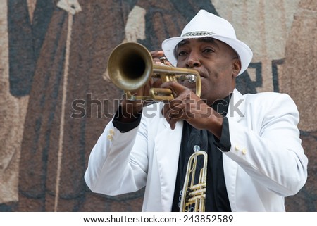 HAVANA, CUBA - JANUARY 8, 2015 : Black cuban musician playing the trumpet