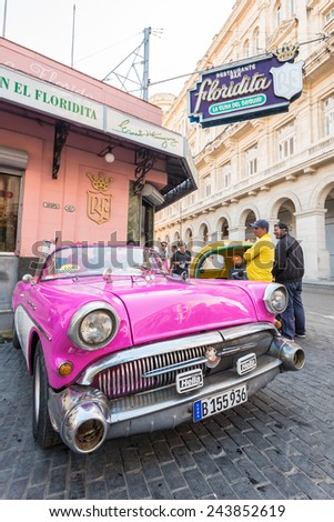 HAVANA, CUBA - JANUARY 8, 2015 : Old american car next to the famous Floridita restaurant in Old Havana