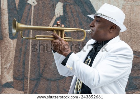 HAVANA, CUBA - JANUARY 8, 2015 : Black cuban musician playing the trumpet
