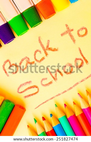 Back to school - Colorful art supplies framing the words BACK TO SCHOOL