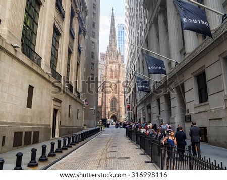 NEW YORK,USA - AUGUST 13,2015 : View of Wall Street and Trinity Church in New York