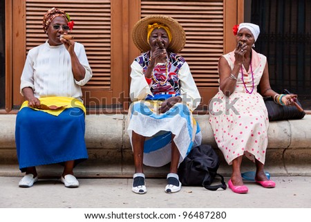 HAVANA-FEBRUARY 26:Women in typical clothing February 26,2012 in Havana.With the growth of foreign tourism people like these,working for tips,make their living posing as traditional cuban characters
