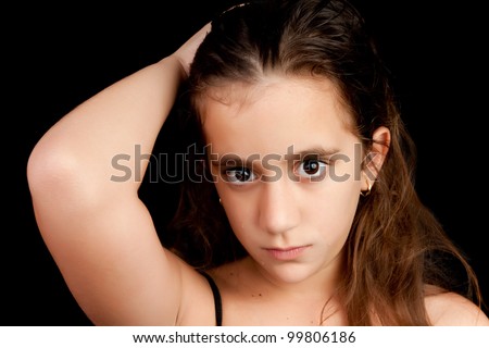 Angry girl crying and looking at the camera isolated on black with space for text