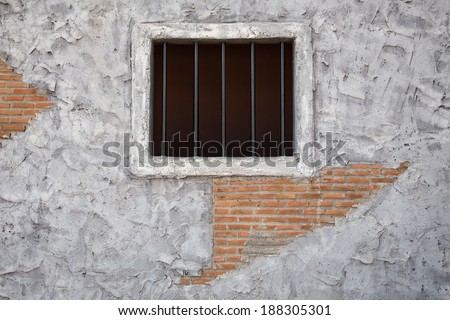 Jail window on cracked cement wall, useful for your wording below the window