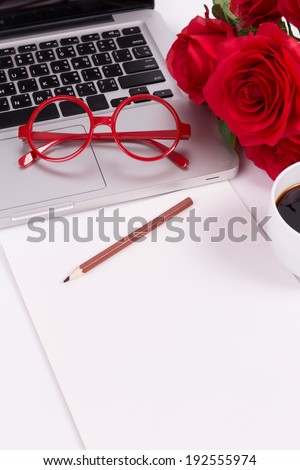 blank paper with laptop, glasses and roses (soft color and vignette filtered)