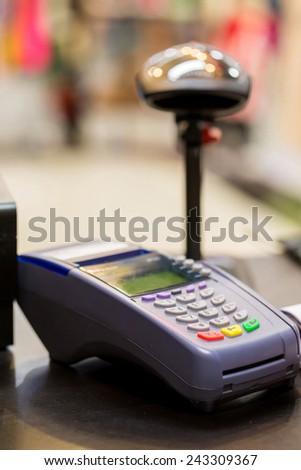 Credit Card Machine with Barcode Scanner in Background at the store : Selective Focus