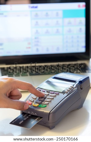 Hand With Credit Card Swipe Through Terminal For Sale In Store