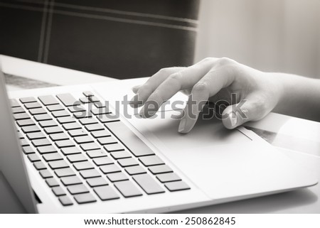 Woman\'s hands typing on laptop keyboard : Selective Focus