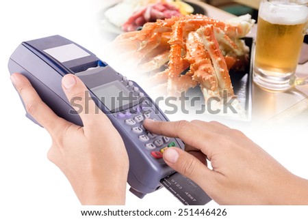 Hand Using Credit Card Machin with Food in Background For Your Restaurant Business