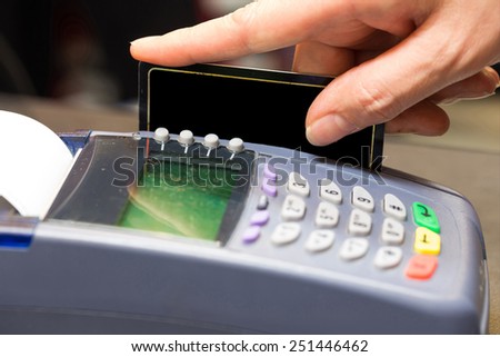 Hand Swiping Blank Credit Card In Store