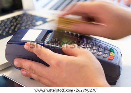 Hand Swiping Credit Card In Store : Selective Focus