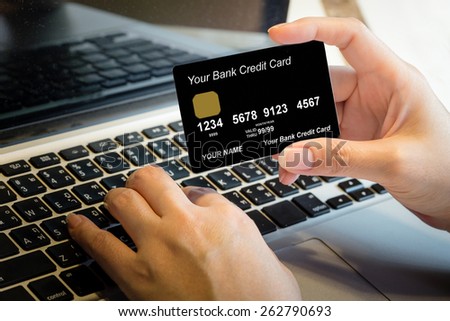 Hand Holding Credit Card Over Laptop Online Shopping Concept