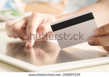 Online Shopping Concept : Human Hand Holding Credit Card (Filtered Process)