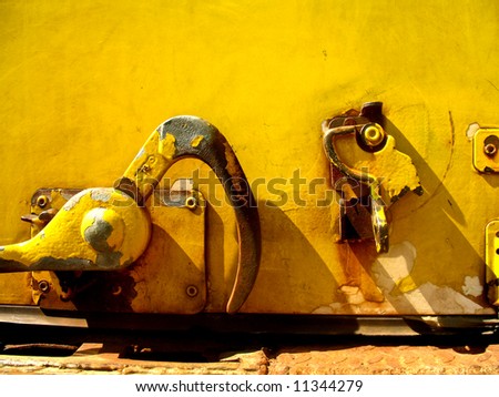 Close up of Yellow latching mechanism for a van door