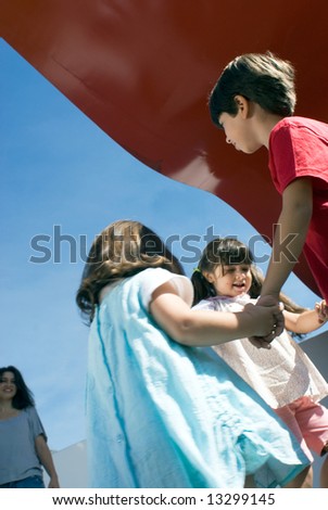 stock photo : Three adorable little kids (siblings) holding hands and 