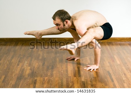 Man in a yoga crouch