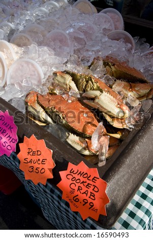 Crabs in ice at market. Vertically framed photo.