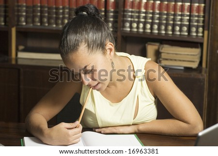 Girl in office studying. Horizontally framed photo.