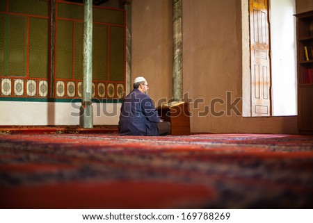 EDIRNE- DECEMBER 28 Muslim man studying the quran in the mosque at Thrace region on December 28 2013 in Edirne Turkey EDIRNE- DECEMBER 28 Muslim man studying the quran in the mosque at Thrace region on December 28 2013 in Edirne Turkey