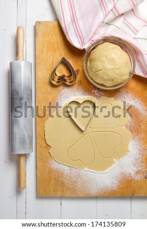 Cookie dough, marble rolling pin and heart shape