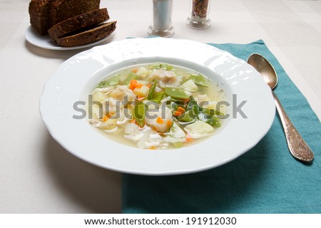Young peas, carrots and cod soup
