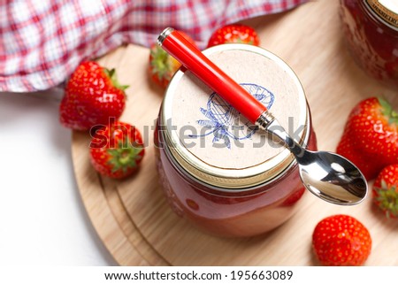 Homemade strawberry rhubarb jam with hand drawn labels