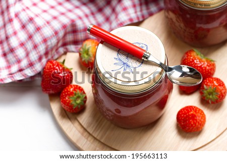 Homemade strawberry rhubarb jam with hand drawn labels
