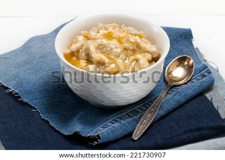 Healthy food - oat bran porridge and honey