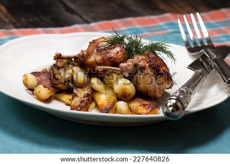 Fried quail cutlets with potatoes and a small onions