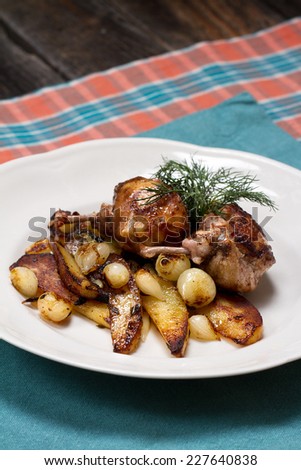Fried quail cutlets with potatoes and a small onions
