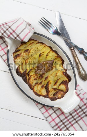 Oven baked potato slices in the cast iron form