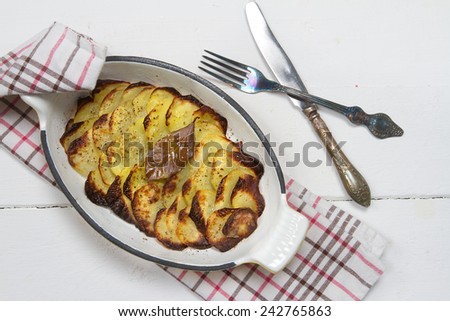 Oven baked potato slices in the cast iron form