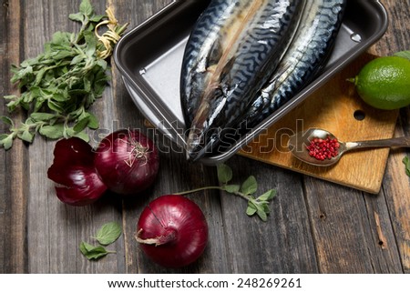 Fresh mackerel with red onion, oregano, lime and pink peppercorns