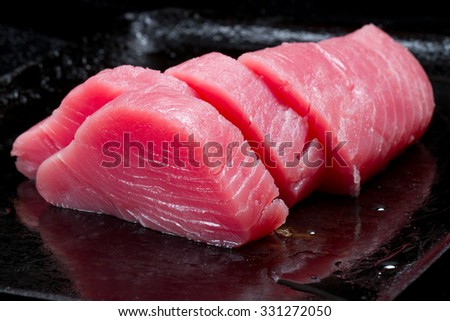 Raw tuna on a dark background