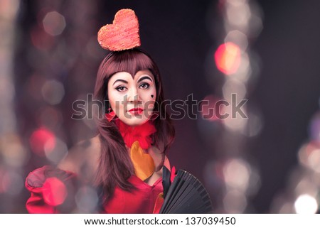 portrait of a queen of hearts on the black background