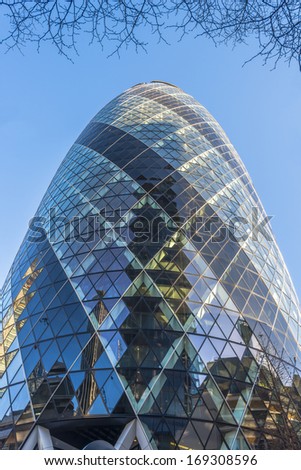 LONDON - DEC 28: View of Gherkin building (30 St Mary Axe) in London on Dec 28, 2013. Gherkin - iconic symbol of London, one of city\'s most widely recognized examples of modern architecture.