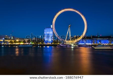 London Eye. London, United Kingdom - April 18, 2014: London, UK, skyline in the evening. London Eye is a famous tourist attraction at a height of 443 ft it is the biggest Ferris wheel in Europe.