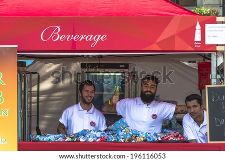 LONDON, UK - JUNE 1st 2014: Turkish men sell drinks during Turkish Day celebrations in Trafalgar Square in London, UK - the event inspired by Turkish community living in the UK