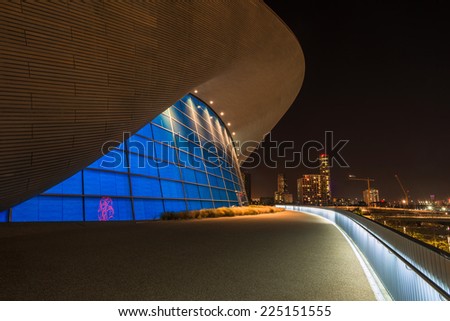 LONDON - October 11th 2014: Night view of The Aquatics Centre in Queen Elizabeth Olympic Park. The building was designed by Zaha Hadid Architects and now open to the public in Stratford, London, UK.