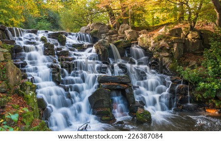 Colorful scenic Cascade in Virginia Water Park, UK - slow shutter speed effect