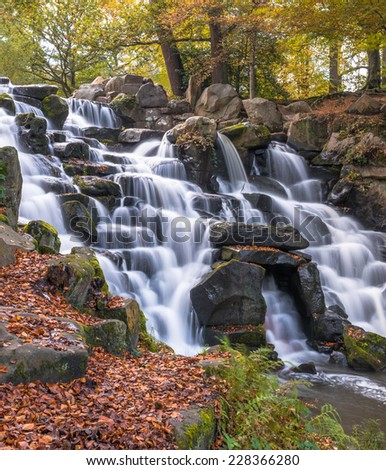 Colorful scenic Cascade in Virginia Water Park, UK - slow shutter speed effect