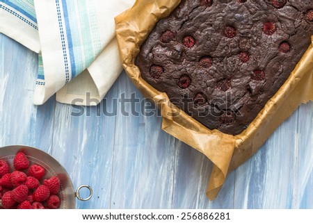 Homemade chocolate brownies with raspberries