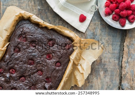 Homemade chocolate brownies with raspberries
