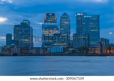LONDON, UK - AUGUST 22, 2015:Evening view of Canary Wharf, a major business district located in London, UK. It\'s a home to the headquarters of numerous major banks and other professional service firms