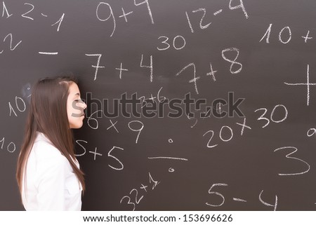 Teacher suffering from acute stress rests her head on the board