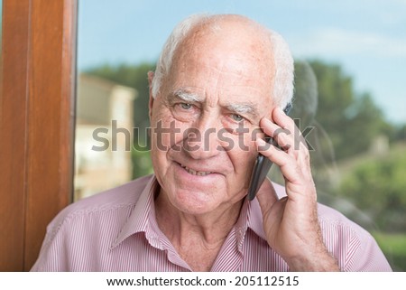 Senior man speaking on mobile phone