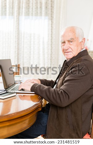 Senior working with Laptop, old man retired