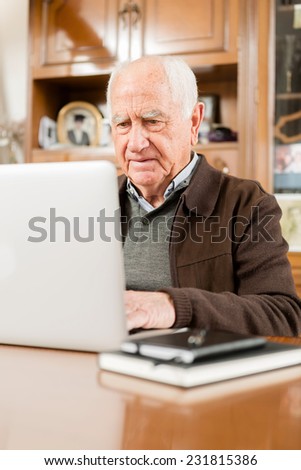 Senior working with Laptop, old man retired