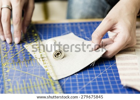hands of Young girl making bags and accessories at home